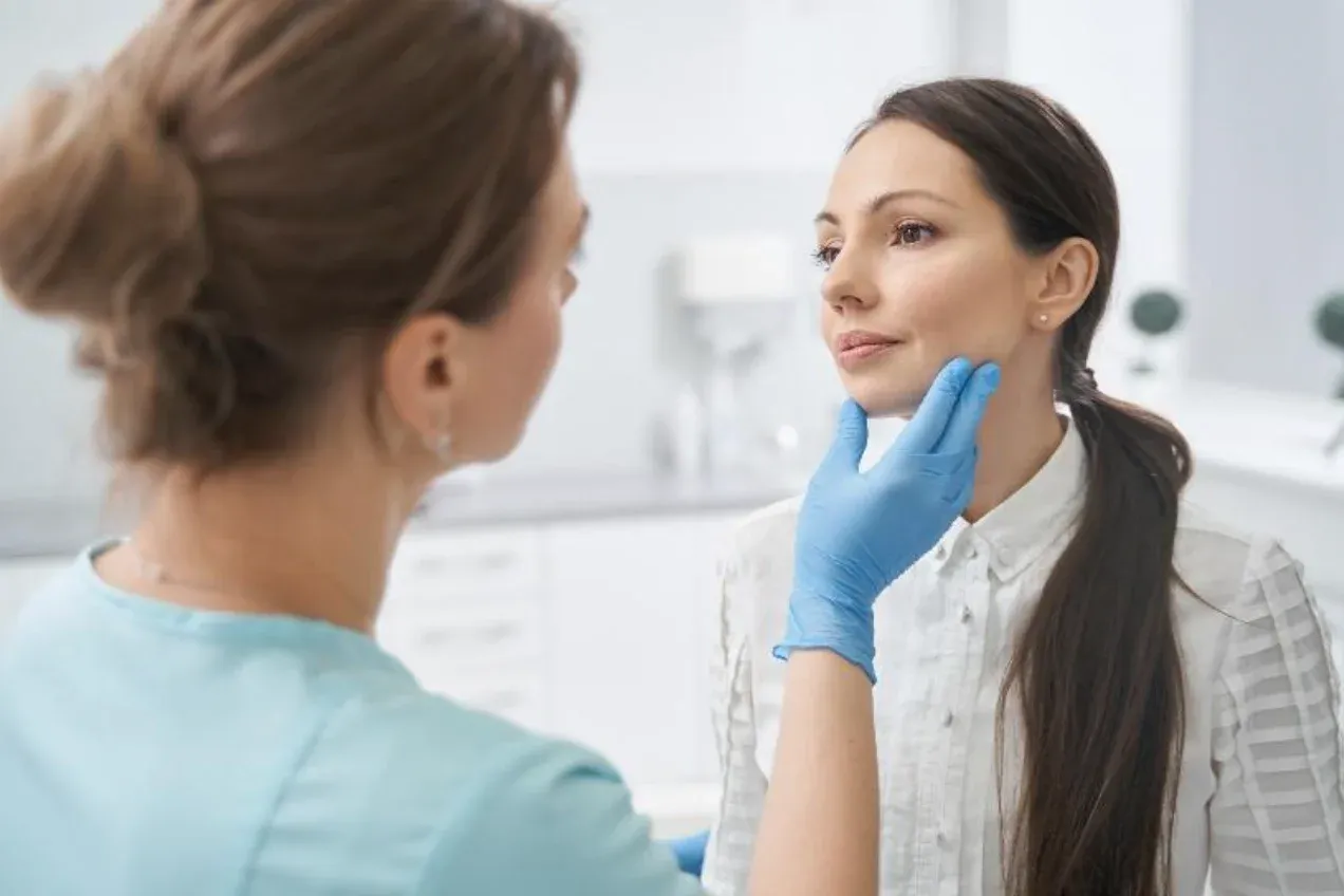 Aesthetic provider explaining treatment options during a patient consultation